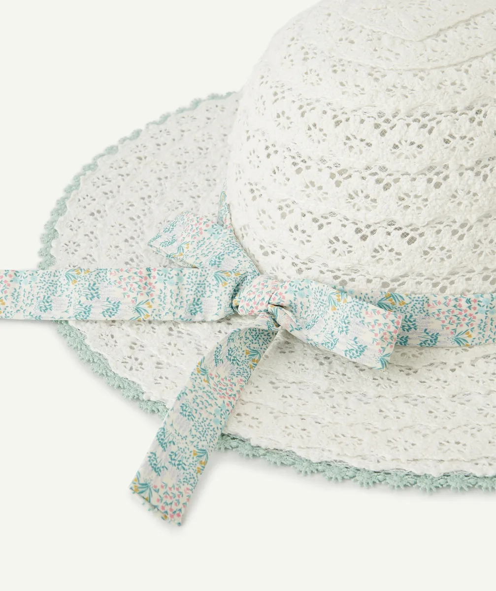 Straw hat with green bow